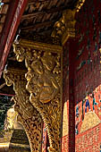 Wat Xieng Thong temple in Luang Prabang, Laos. the Ho Tai, the library. Detail of the console of the roof. 